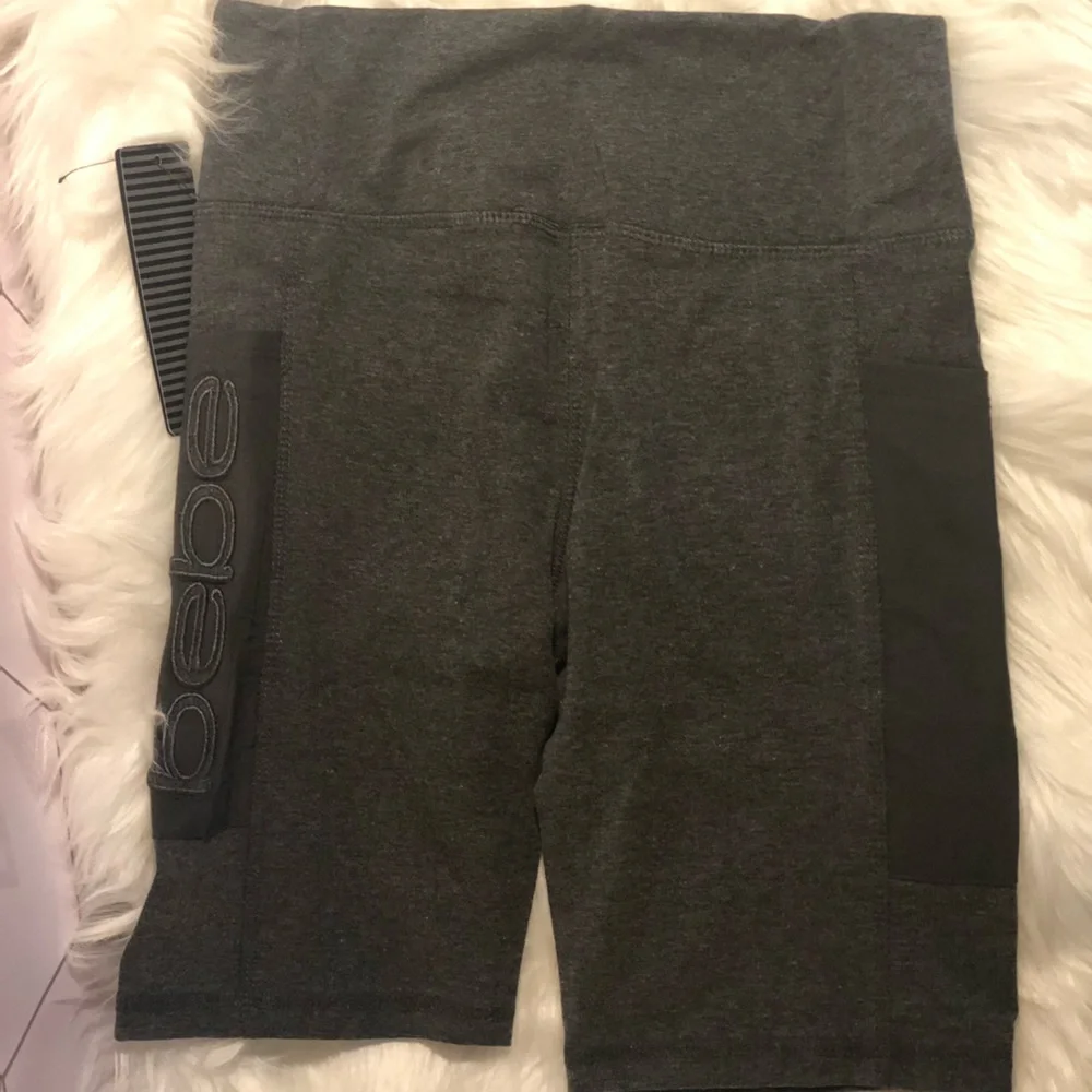 Bebe sport bike shorts with mesh pockets on both sides. Shorts are size small. - Picture 3 of 3